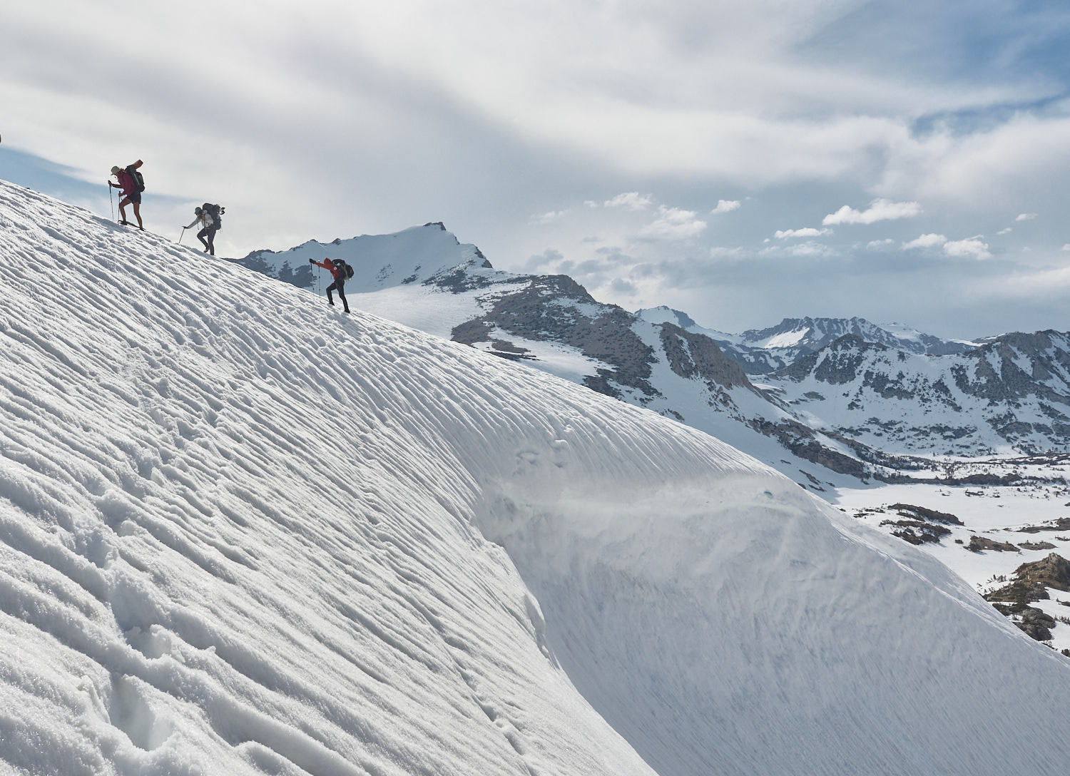 Hikers are bypassing a big cornice on Bishop Pass.