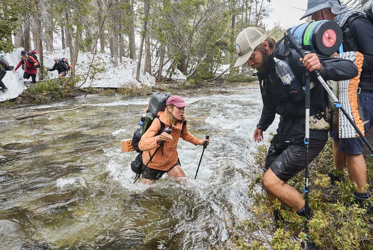 A hiker is crossing Spiller creek.