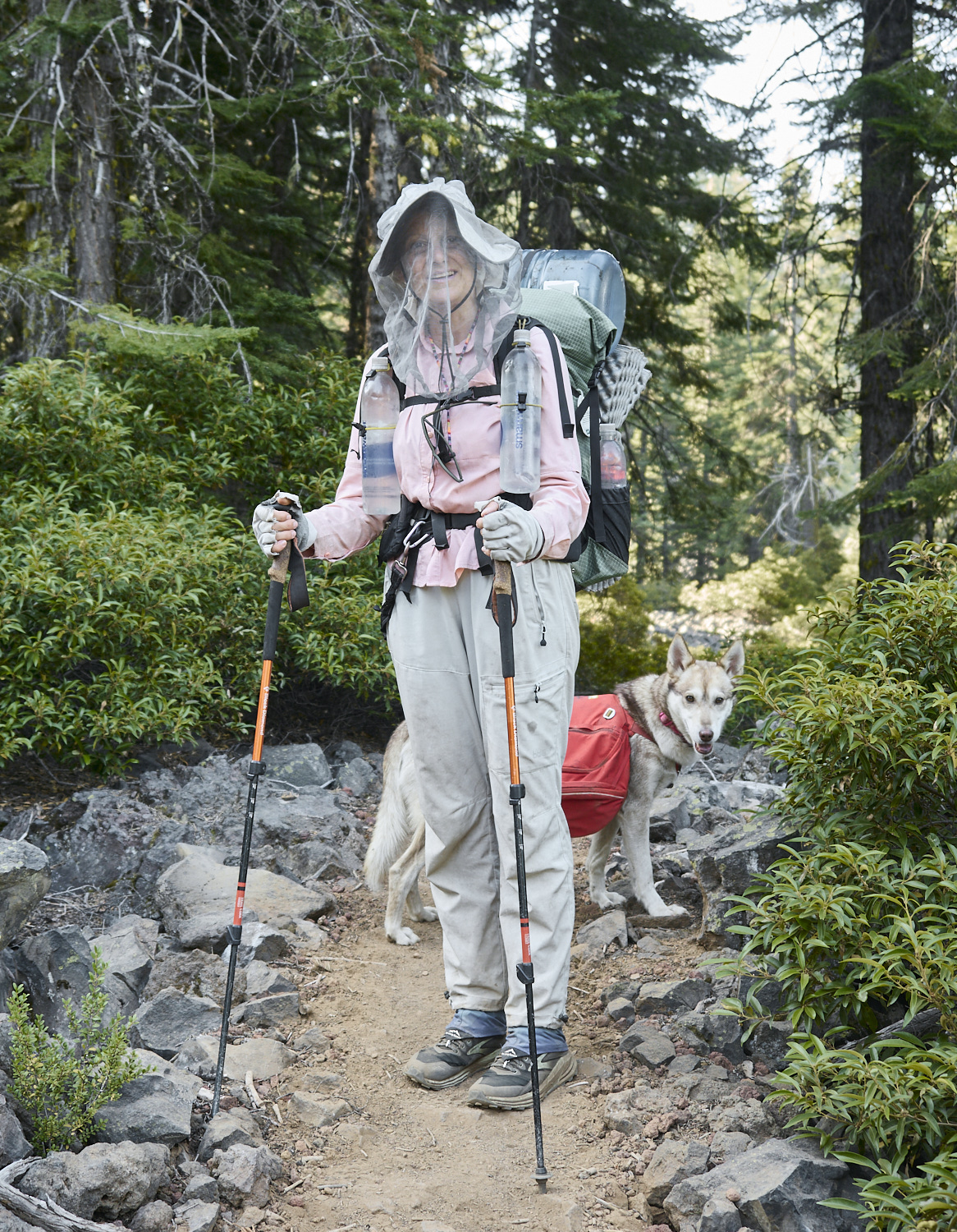 An old female hiker with a dog